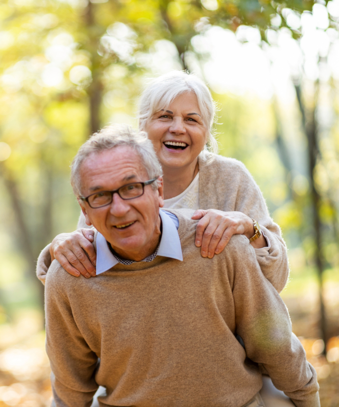 Older couple with woman piggyback