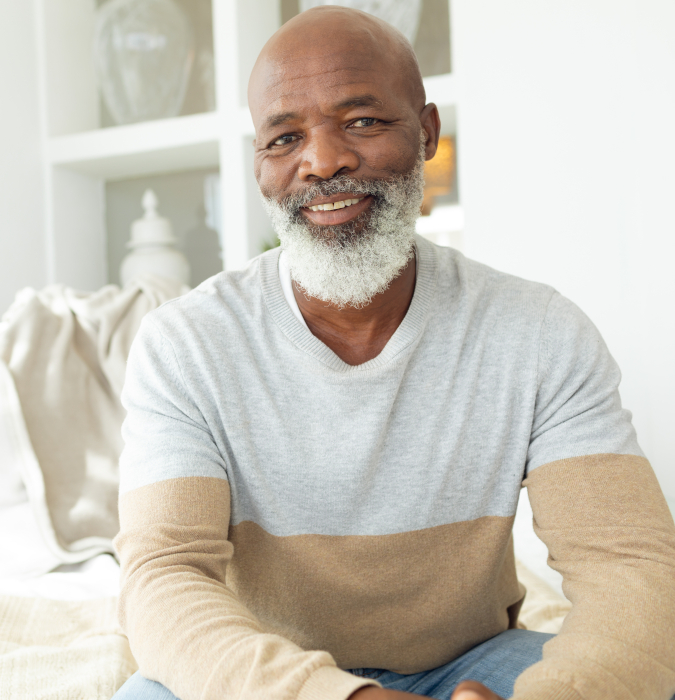 Older man on bed