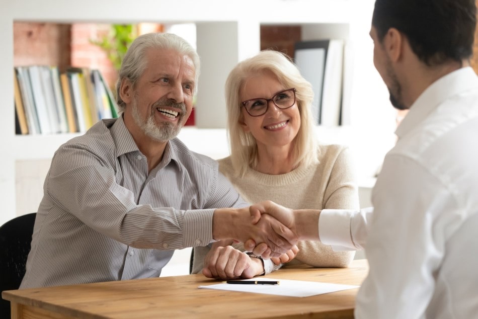 Elderly couple making a deal