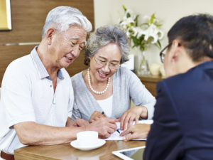 elderly couple signs contract