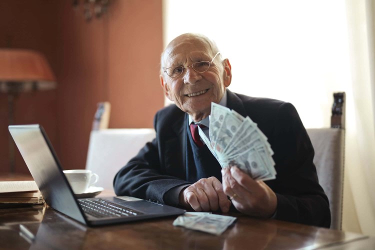 Senior man with money