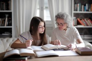 grandparent helping grandchild study