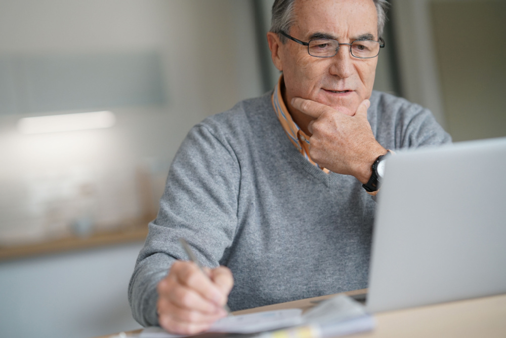 Senior looking at computer