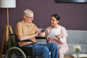 woman explaining nursing home costs to senior