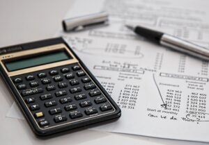 budget breakdown and calculator on a table