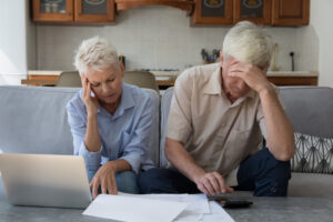 retired couple looking at their finances
